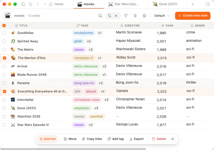 A folder as a table: title, tags, director, year and genre columns, rows selected