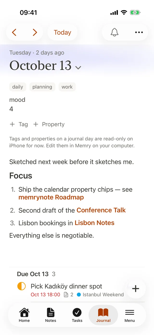 A journal day on iPhone with linked notes and tasks